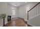 Bright foyer with hardwood floors, decorative molding, and a staircase, creating an inviting atmosphere at 49 Salt Cedar Ln, Chapel Hill, NC 27516