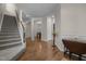 Elegant foyer with hardwood floors, wainscoting, and a staircase, setting a sophisticated tone at 49 Salt Cedar Ln, Chapel Hill, NC 27516