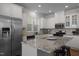 Bright kitchen features granite countertops, stainless steel appliances, and a central island with barstool seating at 49 Salt Cedar Ln, Chapel Hill, NC 27516