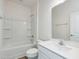 Clean bathroom features a shower-tub combo, large mirror, and white sink at 504 Winding Creek Dr Dr, Lillington, NC 27546