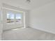Bright bedroom with two large windows and neutral carpet at 504 Winding Creek Dr Dr, Lillington, NC 27546