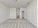 Open carpeted bedroom with walk in closet and neutral paint at 504 Winding Creek Dr Dr, Lillington, NC 27546