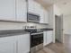 Bright kitchen features stainless steel appliances, granite countertops, and white cabinetry at 504 Winding Creek Dr Dr, Lillington, NC 27546