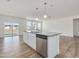 Kitchen island with granite counters, stainless steel dishwasher, and pendant lighting at 504 Winding Creek Dr Dr, Lillington, NC 27546