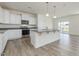 Beautiful kitchen boasts a large island, granite countertops and stainless steel appliances at 504 Winding Creek Dr Dr, Lillington, NC 27546
