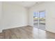 The living room features wood-look floors, neutral paint and sliding glass door at 504 Winding Creek Dr Dr, Lillington, NC 27546