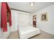 Bright bedroom features a murphy bed, built-ins, tan carpet, and decorative lighting at 515 Poplar Dr, Raleigh, NC 27603