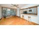 Open dining area with breakfast bar to kitchen with hardwood floors and ceiling fan at 515 Poplar Dr, Raleigh, NC 27603