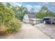 Detached garage with multiple bays and a paved driveway, offering plenty of storage at 515 Poplar Dr, Raleigh, NC 27603