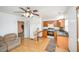 Cozy kitchen with wood cabinets, updated appliances, and a view of a light-filled living space at 515 Poplar Dr, Raleigh, NC 27603