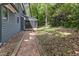 Exterior shot of a house with a brick path leading to a screened porch at 522 Lochness Ln, Cary, NC 27511