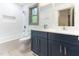 Updated bathroom with modern vanity, fixtures, subway tile, and natural light at 522 Lochness Ln, Cary, NC 27511