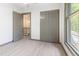 Updated bedroom with closet, connecting door, modern fan, and updated flooring at 522 Lochness Ln, Cary, NC 27511