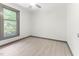 Neutral bedroom with natural light, updated flooring, and painted trim and doors at 522 Lochness Ln, Cary, NC 27511