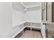 Walk-in closet with bright white walls, corner shelving, and space for storage at 522 Lochness Ln, Cary, NC 27511