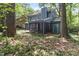 Exterior of home featuring a screened-in porch in a wooded lot at 522 Lochness Ln, Cary, NC 27511