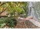 Landscaped path leading to a house with gray siding at 522 Lochness Ln, Cary, NC 27511