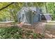 Charming two-story home with gray siding, brick path, and lush landscaping at 522 Lochness Ln, Cary, NC 27511