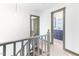 Upstairs hallway leads to rooms and includes updated gray bannister and railing at 522 Lochness Ln, Cary, NC 27511