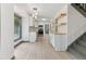 Well lit Kitchen with stainless appliances, stone countertops, pendant lights and modern flooring at 522 Lochness Ln, Cary, NC 27511