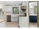 Stylish kitchen offers stainless steel appliances, white cabinetry, and butcher block countertops at 522 Lochness Ln, Cary, NC 27511