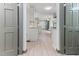 Open concept kitchen with white cabinetry, butcher block counters, stainless appliances and views of adjacent rooms at 522 Lochness Ln, Cary, NC 27511