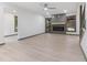 Modern living room featuring light flooring, fireplace with mantle, and a walk-out to the porch at 522 Lochness Ln, Cary, NC 27511