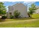 View of backyard with green lawn, mature trees and landscaping, a peaceful outdoor space at 524 Woodson Dr, Clayton, NC 27527