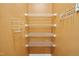 Walk-in closet with multiple levels of shelving, optimizing storage space at 524 Woodson Dr, Clayton, NC 27527