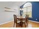 Elegant dining room showcasing a round table, six chairs, and a large arched window at 524 Woodson Dr, Clayton, NC 27527