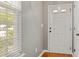 Bright foyer with hardwood floors, white door, and natural light at 524 Woodson Dr, Clayton, NC 27527