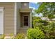 Close up of the front entry and lush greenery add to the charm of this home at 524 Woodson Dr, Clayton, NC 27527