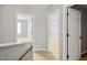 Hallway featuring open doorways to rooms with carpet flooring at 524 Woodson Dr, Clayton, NC 27527