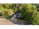Aerial view of a charming home nestled among lush trees, showcasing a well-maintained yard and inviting curb appeal at 535 W Holding Ave, Wake Forest, NC 27587
