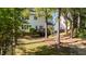 Exterior view of home with a patio and trees at 535 W Holding Ave, Wake Forest, NC 27587