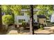 Exterior view of home with a patio and trees at 535 W Holding Ave, Wake Forest, NC 27587