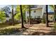 Exterior view of home with a patio and trees at 535 W Holding Ave, Wake Forest, NC 27587