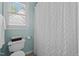 Bright and airy bathroom showing a shower and toilet at 535 W Holding Ave, Wake Forest, NC 27587