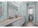 Bright bathroom featuring double vanity with granite countertops and modern fixtures at 535 W Holding Ave, Wake Forest, NC 27587