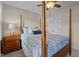 Bedroom featuring four-poster bed, ceiling fan, and a bedside table at 535 W Holding Ave, Wake Forest, NC 27587