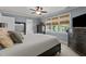 Bedroom boasting natural light with a ceiling fan, chest of drawers, and neutral carpet at 535 W Holding Ave, Wake Forest, NC 27587