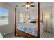 Bedroom featuring a four-poster bed, ceiling fan, and a window that provides natural light at 535 W Holding Ave, Wake Forest, NC 27587