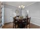 Formal dining area with hardwood floors, a chandelier, and a round table set for dining at 535 W Holding Ave, Wake Forest, NC 27587