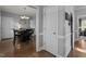 Elegant dining room featuring a dining table with a chandelier, dark wood floors and neutral walls at 535 W Holding Ave, Wake Forest, NC 27587