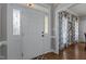 Welcoming foyer with a decorative front door, hardwood floors, and a view into adjacent rooms at 535 W Holding Ave, Wake Forest, NC 27587