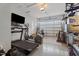 Well-lit garage featuring an exercise area and storage at 535 W Holding Ave, Wake Forest, NC 27587