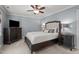 Calm main bedroom with dark wood furniture, soft lighting, and neutral tones for a relaxing atmosphere at 535 W Holding Ave, Wake Forest, NC 27587
