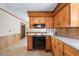 Kitchen showcases wood cabinets, laminate countertops, and a black electric range oven at 5652 Laurel Crest Dr, Durham, NC 27712