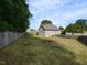 Well-maintained backyard featuring a lush lawn and privacy fence at 70 King Mackeral Ct, Willow Springs, NC 27592
