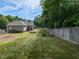 Large backyard with a fenced perimeter, swing set and trampoline at 70 King Mackeral Ct, Willow Springs, NC 27592